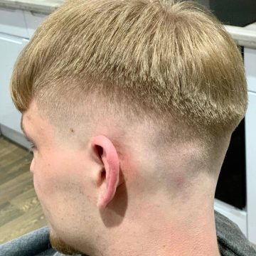 London mobile barber creating a bespoke hair design with precise shaving and toner application